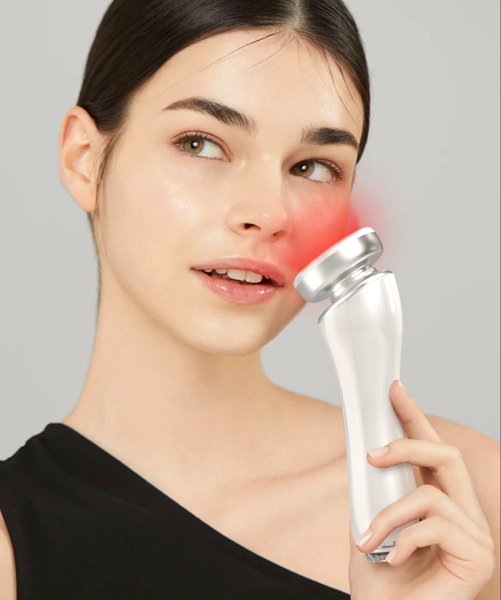 Woman using SkinDr600 with red light on cheek